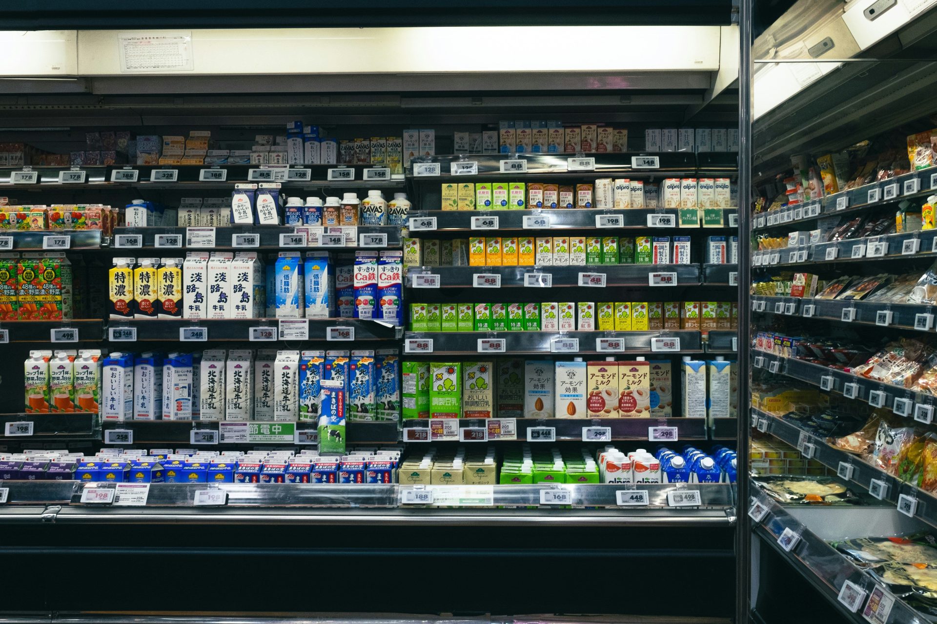 Shelves stocked with beverages and food items in a store
