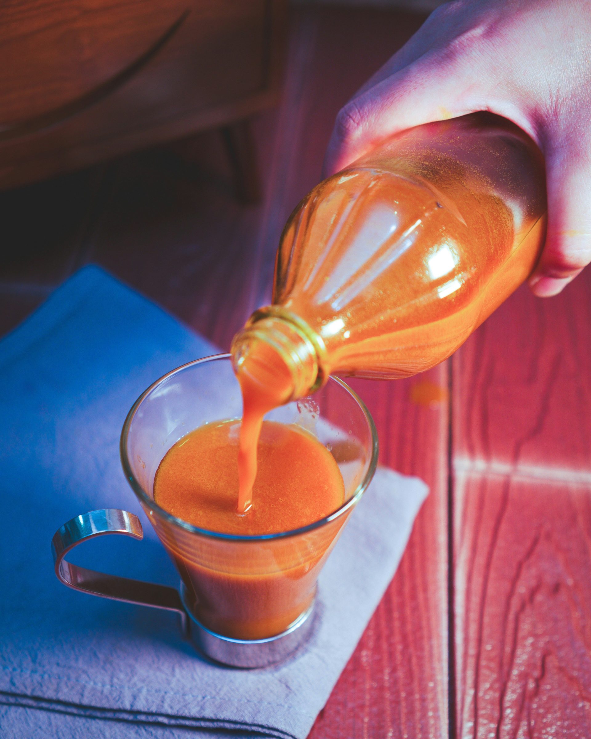 clear glass mug with brown liquid